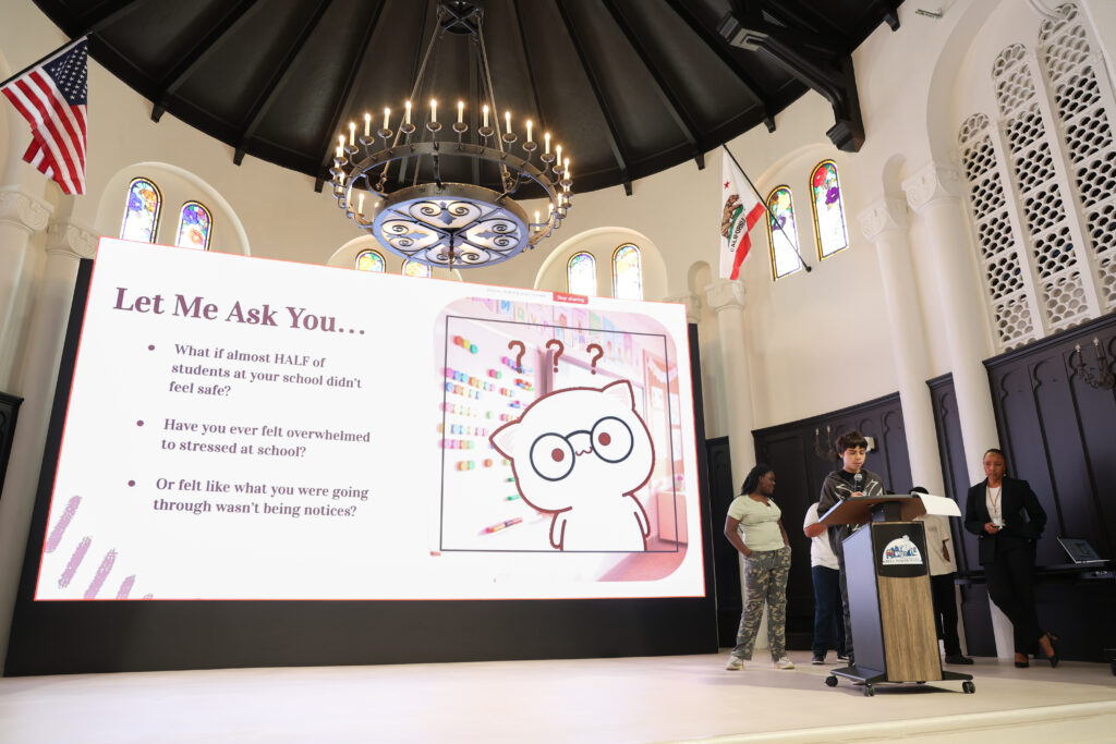 alt= "Students presenting their project on mental health."