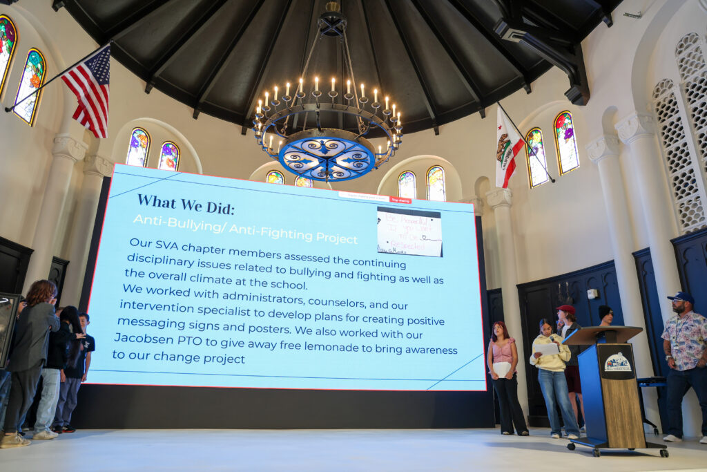 alt= "Students presenting their project on anti-bullying."