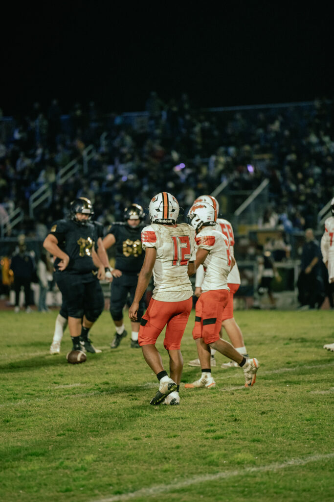 Braydon Ricks playing football.