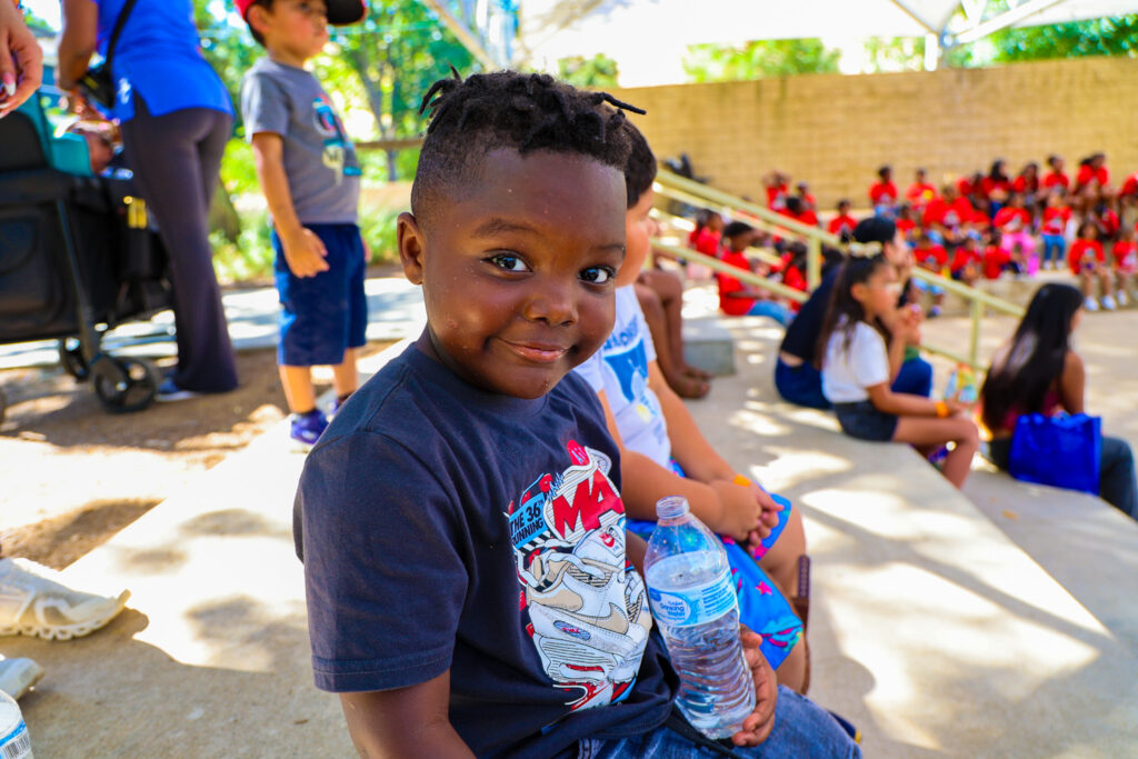 A boy smiling at the camera.