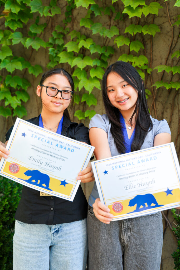 The Huynh sisters' holding their special award.