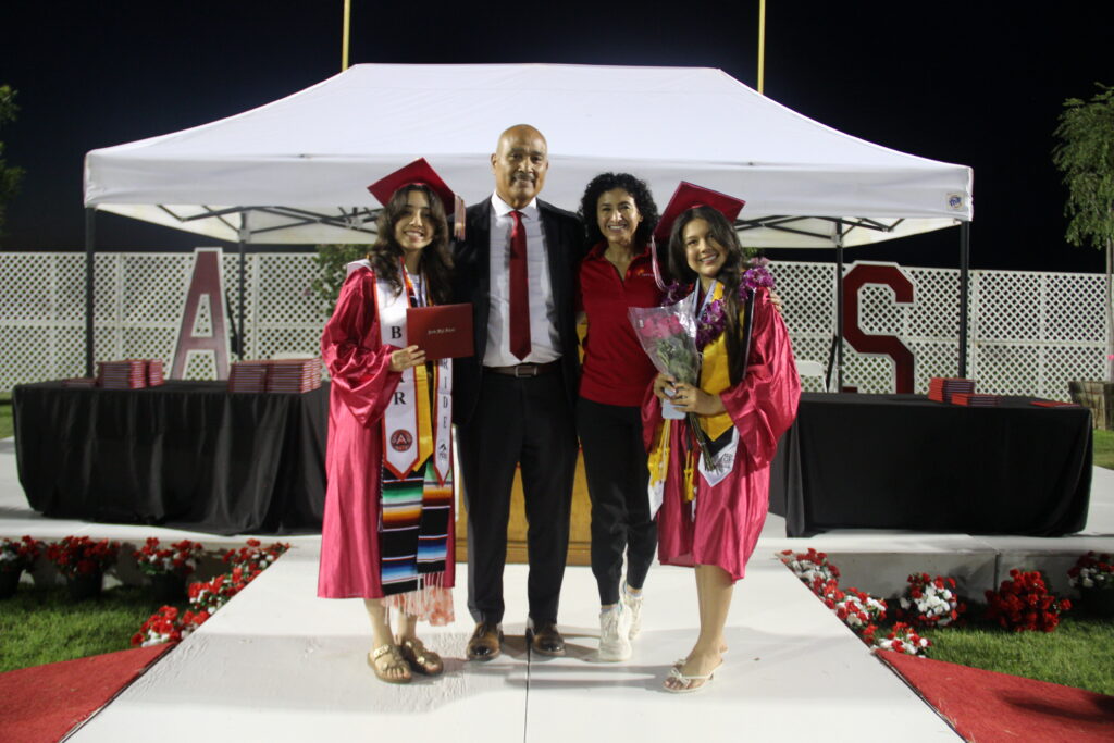 Photo of Acosta Vasquez with the mayor of Arvin and two other Gates scholarship fellows.