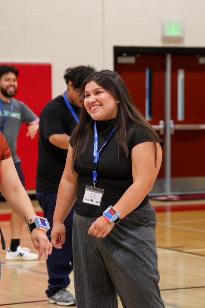 After-school professional smiling while playing ZTAG.