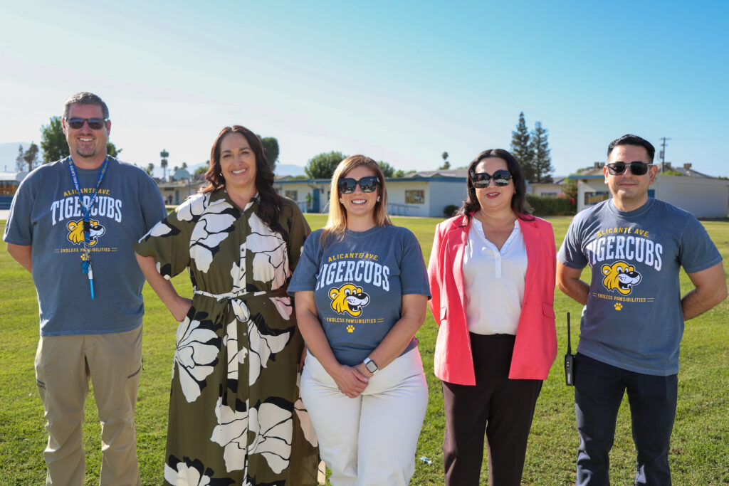 Photo of Superintendent Charles with district leaders on the first day of school.